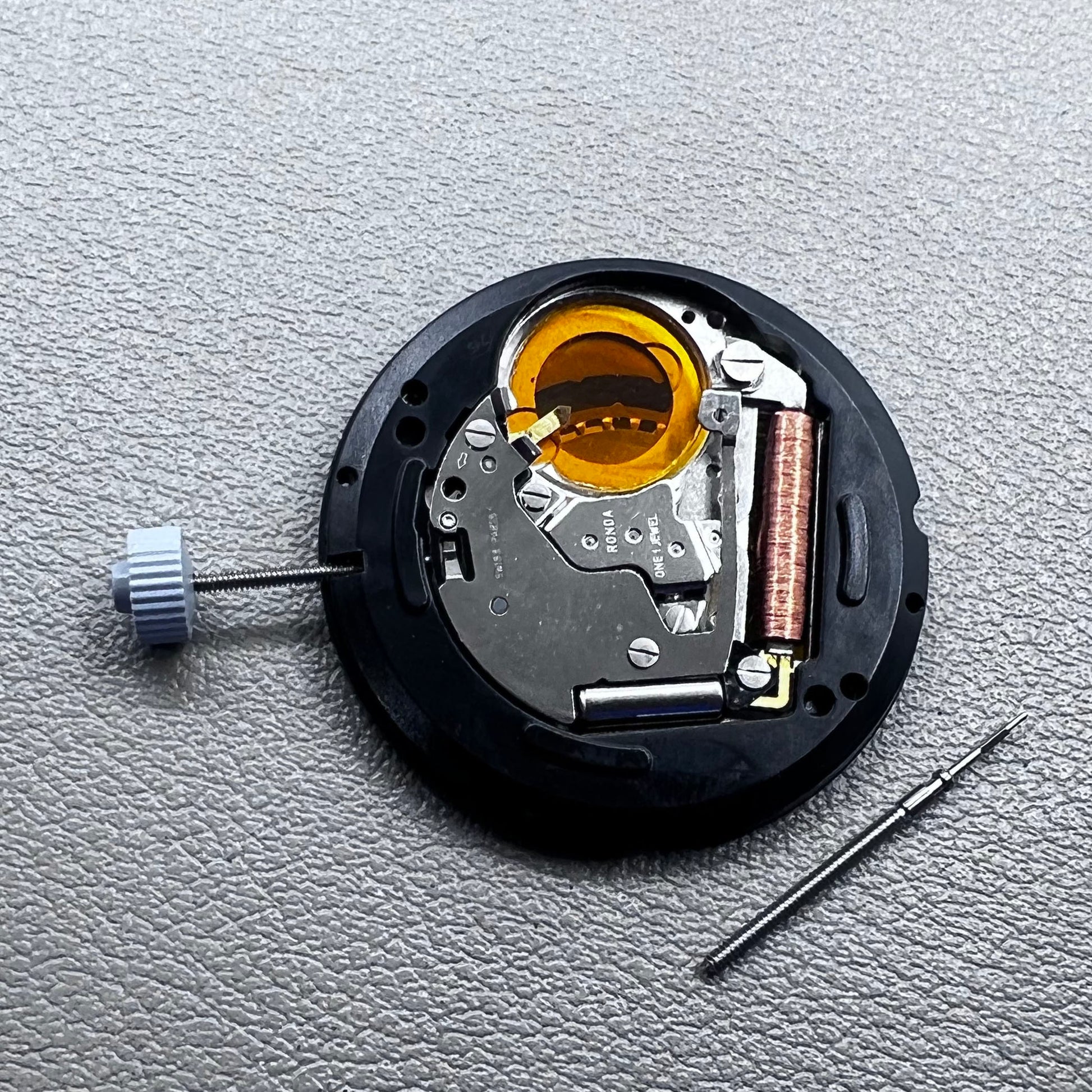 Swiss Ronda 715 quartz watch movement with date display at 3 o'clock, precision timing for accessories.