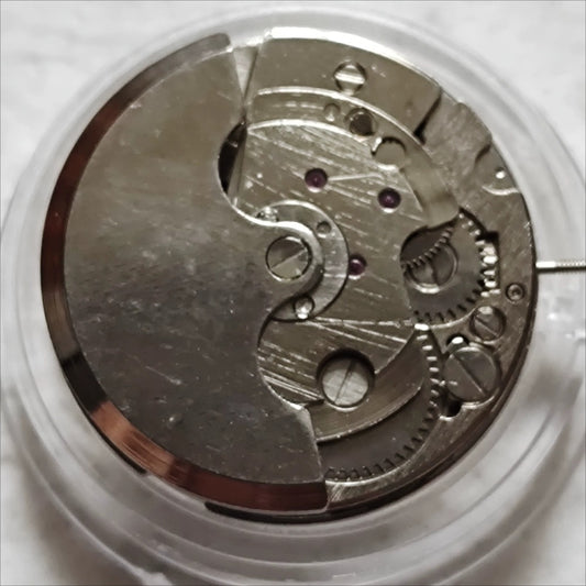 China Made 7120 mechanical watch with moon phase at 6 o'clock and bare wheel at 9 o'clock, elegant design.