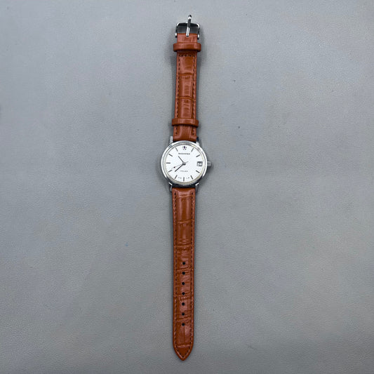 Light brown Shanghai manual mechanical watch with single calendar, 17 jewels, shock-resistant design for durability.