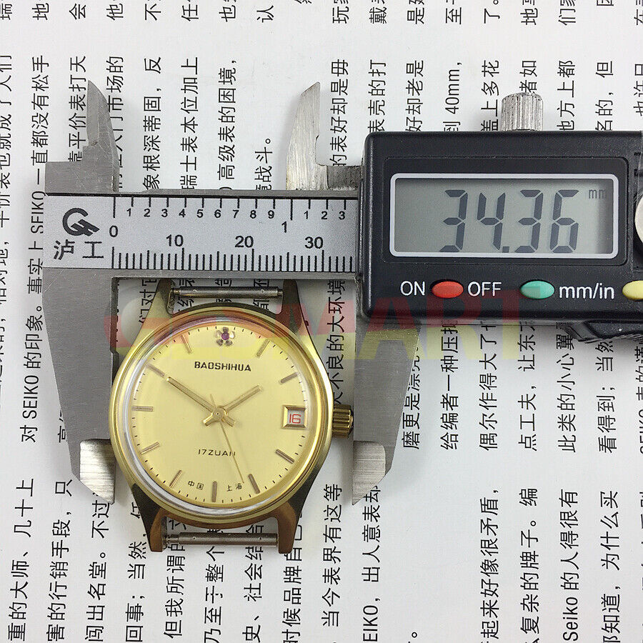 33mm manual mechanical watch with yellow dial, single calendar, 17 jewels, and shock-resistant design.