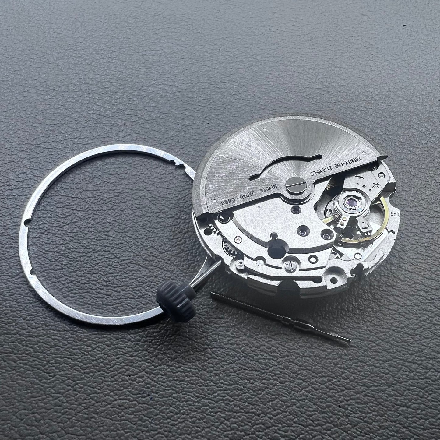 Japan Miyota 8215 watch movement with white dial, automatic mechanical, date display at 6 o'clock by Miyota.