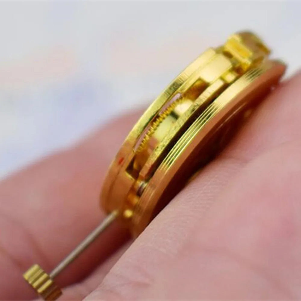 Gold 27mm 17-jewel skeleton automatic watch movement with pendulum adjustment by Radiation Pattern, 2004 model.