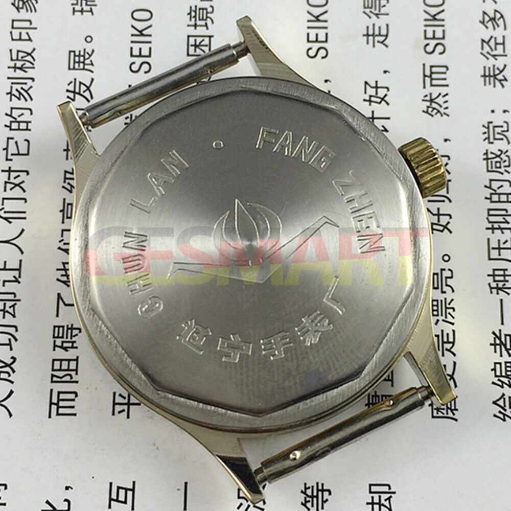 32mm manual mechanical watch with 17 jewels, yellow dial, and green lume hands for precise timekeeping.