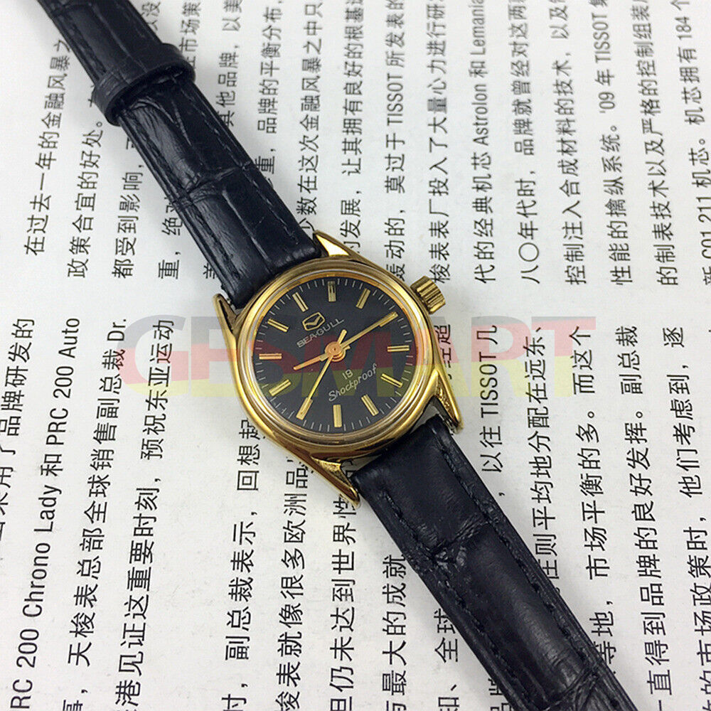 Tianjin Seagull ladies watch with black round case, gold nail markers, and manual mechanical movement.