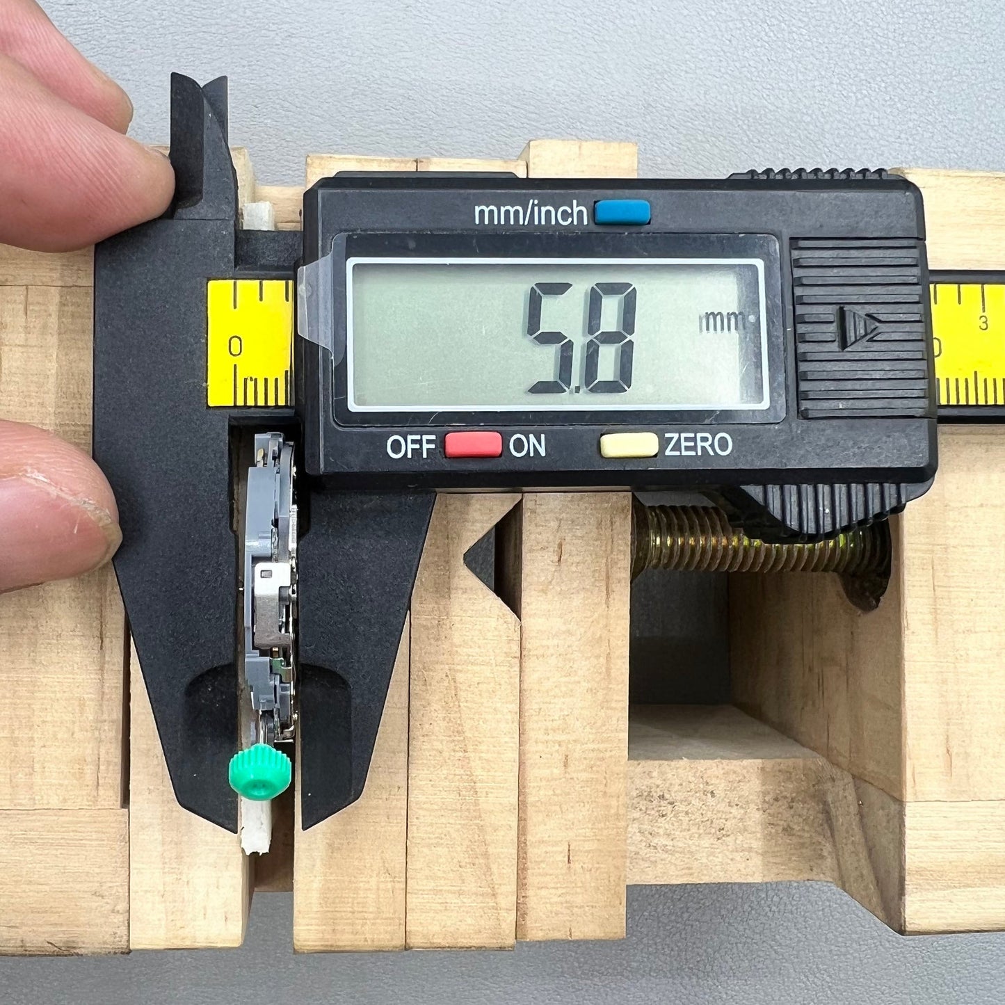 Japan Miyota OS10 quartz watch movement with date display at 3 o'clock, precision timekeeping accessory.