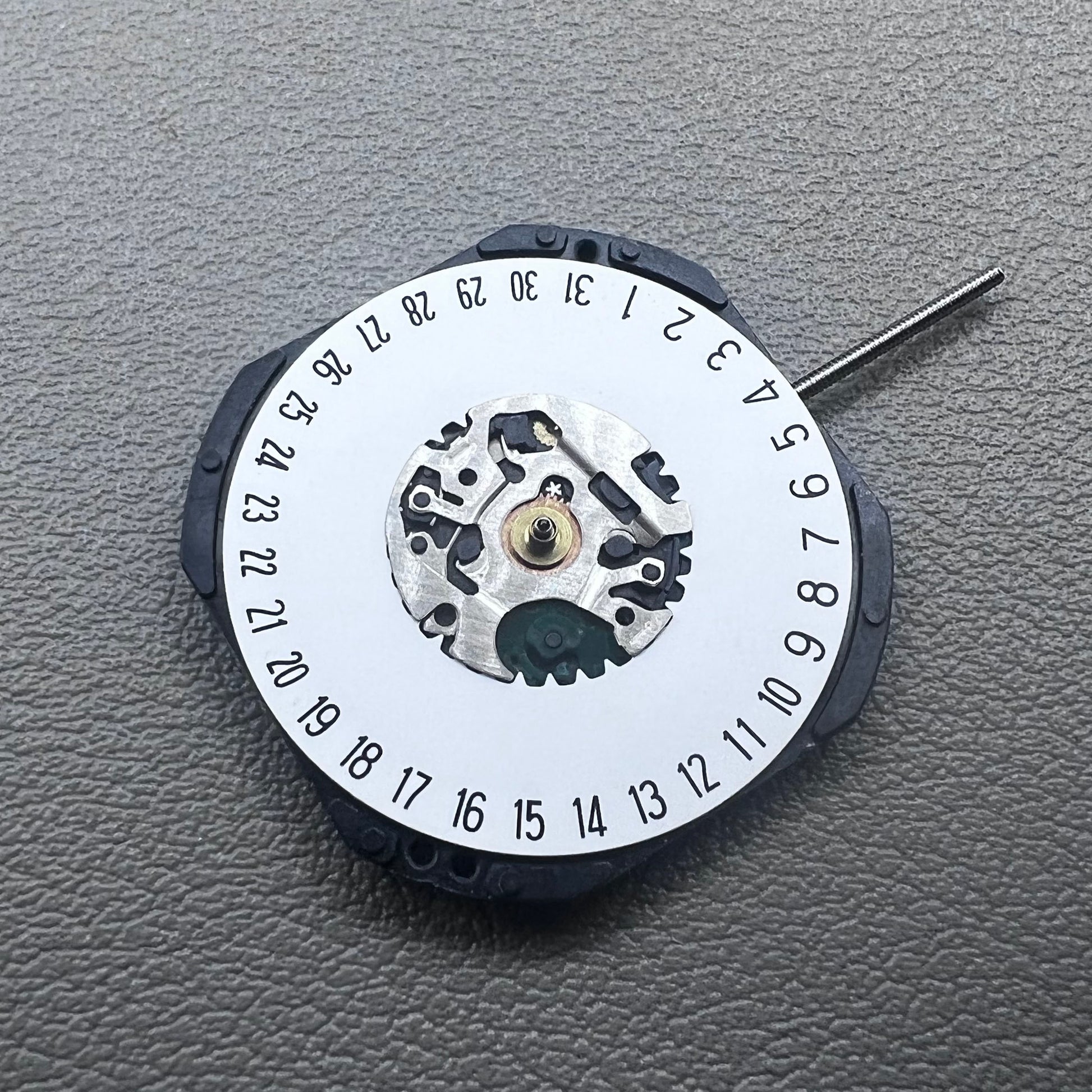 Japan Hattori Epson VX42E quartz watch movement with date display at 6 o'clock, precision timing.