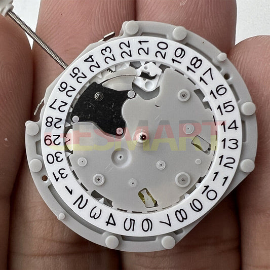 Sunon PE70 quartz watch movement with 3 hands, 3 sub-dials, date display at 3 and 6 o'clock positions.