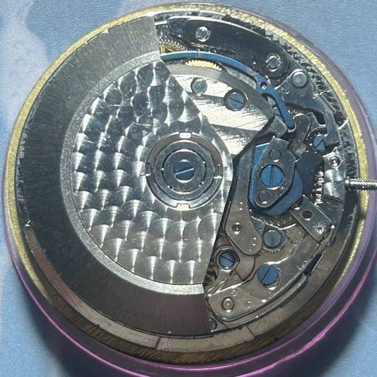 Dandong 7750 watch accessory featuring mechanical movement with double seconds and small second hands at 3 and 9 o'clock positions.