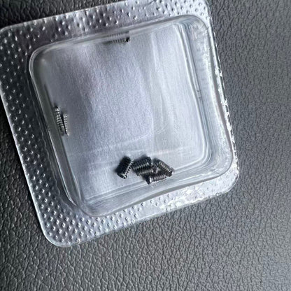 Silver 2.5x1mm slotted watch back cover screws for Cartier women's watches, durable replacement parts.