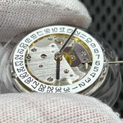 Asian 7750 automatic chronograph movement showing day-date at 3 o'clock, high precision ETA style mechanism