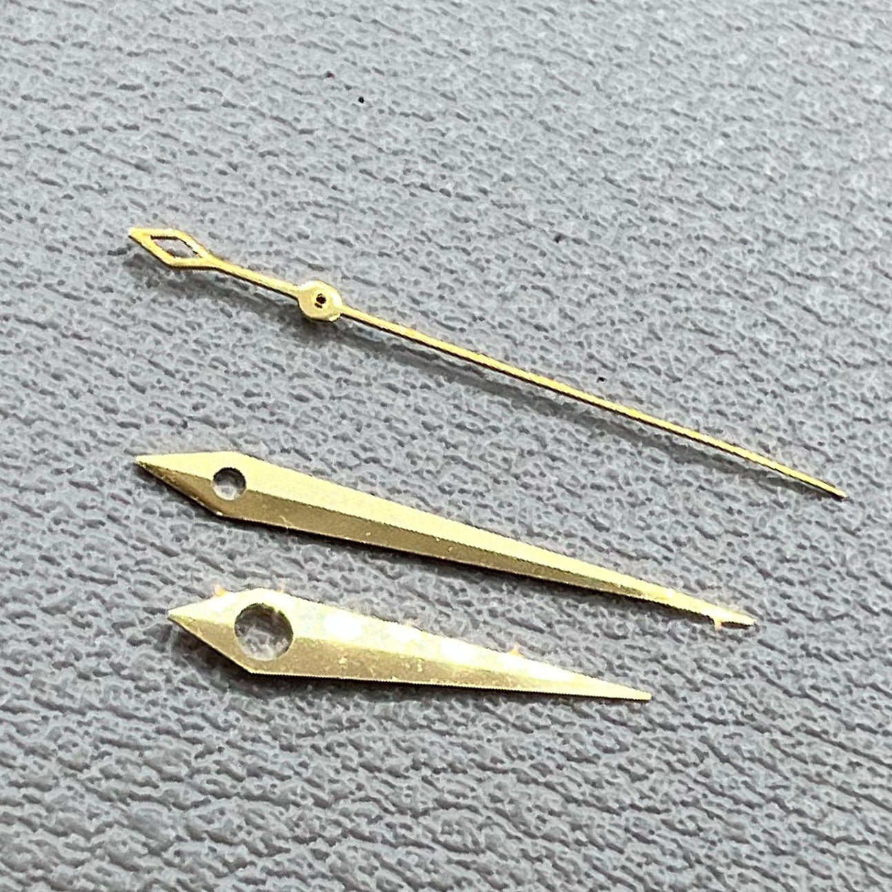 Golden rhombus tail watch hands set for NH35 NH36 NH38 movements, no lume, sleek design.