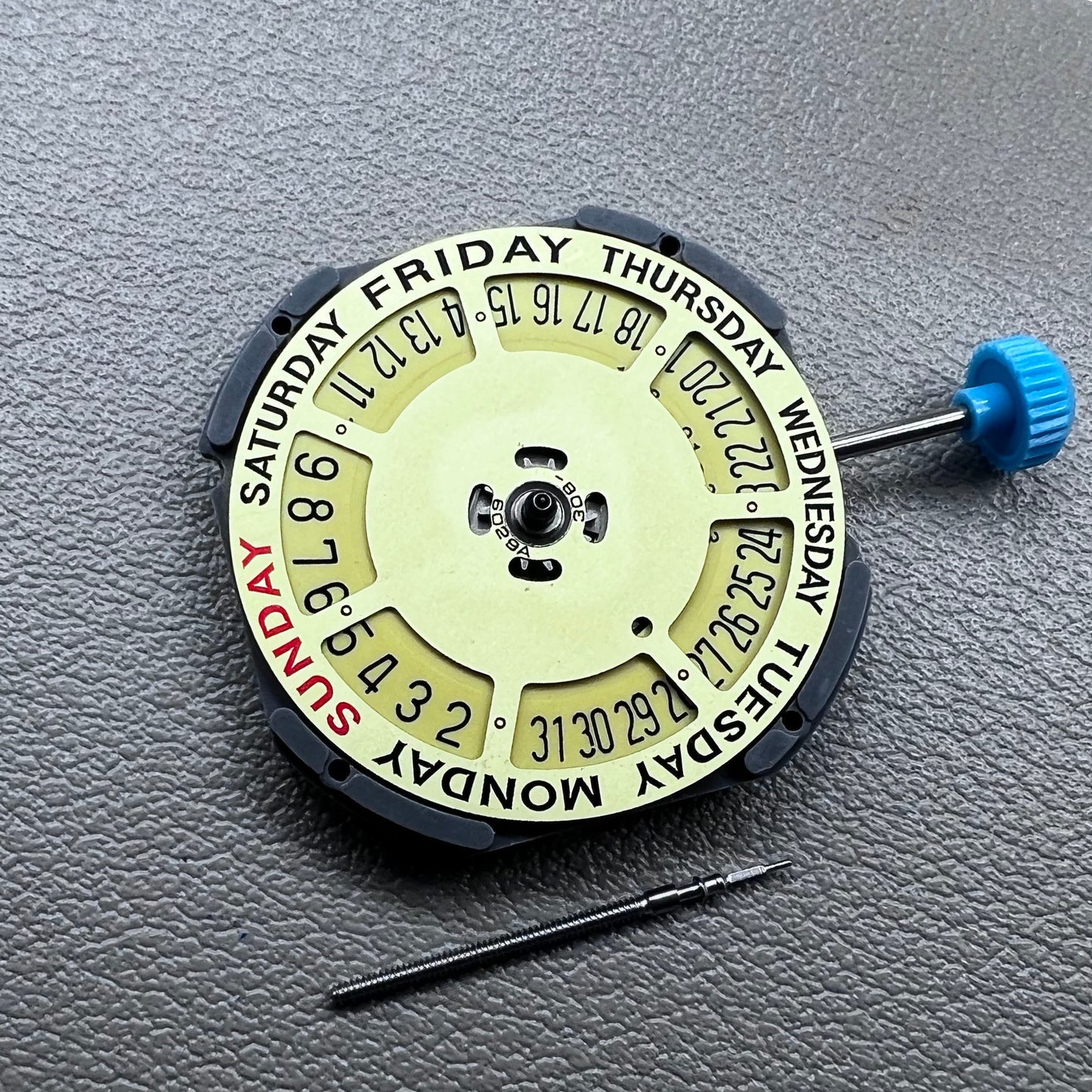 Japan Miyota 6M50 Quartz watch movement with golden dial, date at 6 o'clock, 3 hands, precise timekeeping.