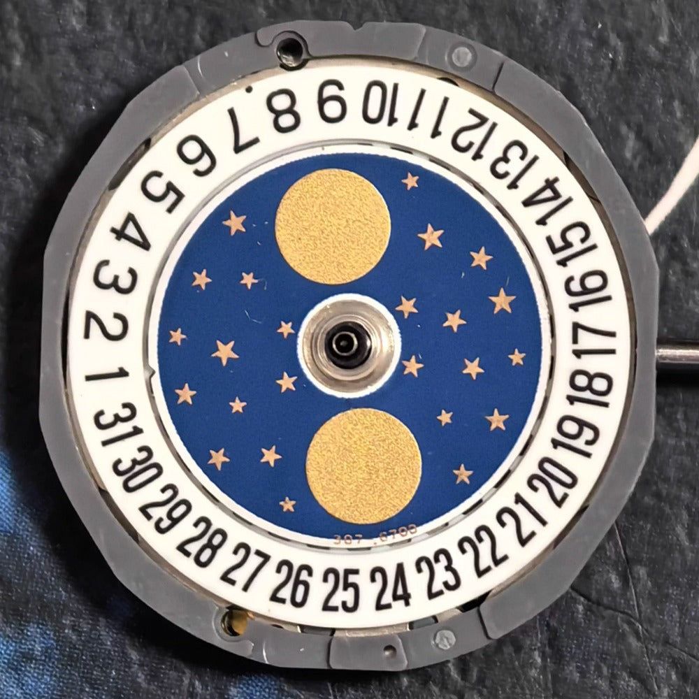 Miyota 6L85 quartz watch movement with date at 6, moonphase, and three hands by Japan Made.