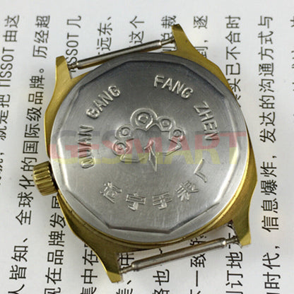 Old Stock Dandong manual mechanical watch with 17 jewels, single calendar, and golden dial for classic style.
