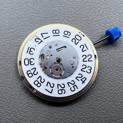 Swiss ETA F06.161 quartz watch movement with white dial, 3 hands, and date at 3 o?clock for precise timekeeping.