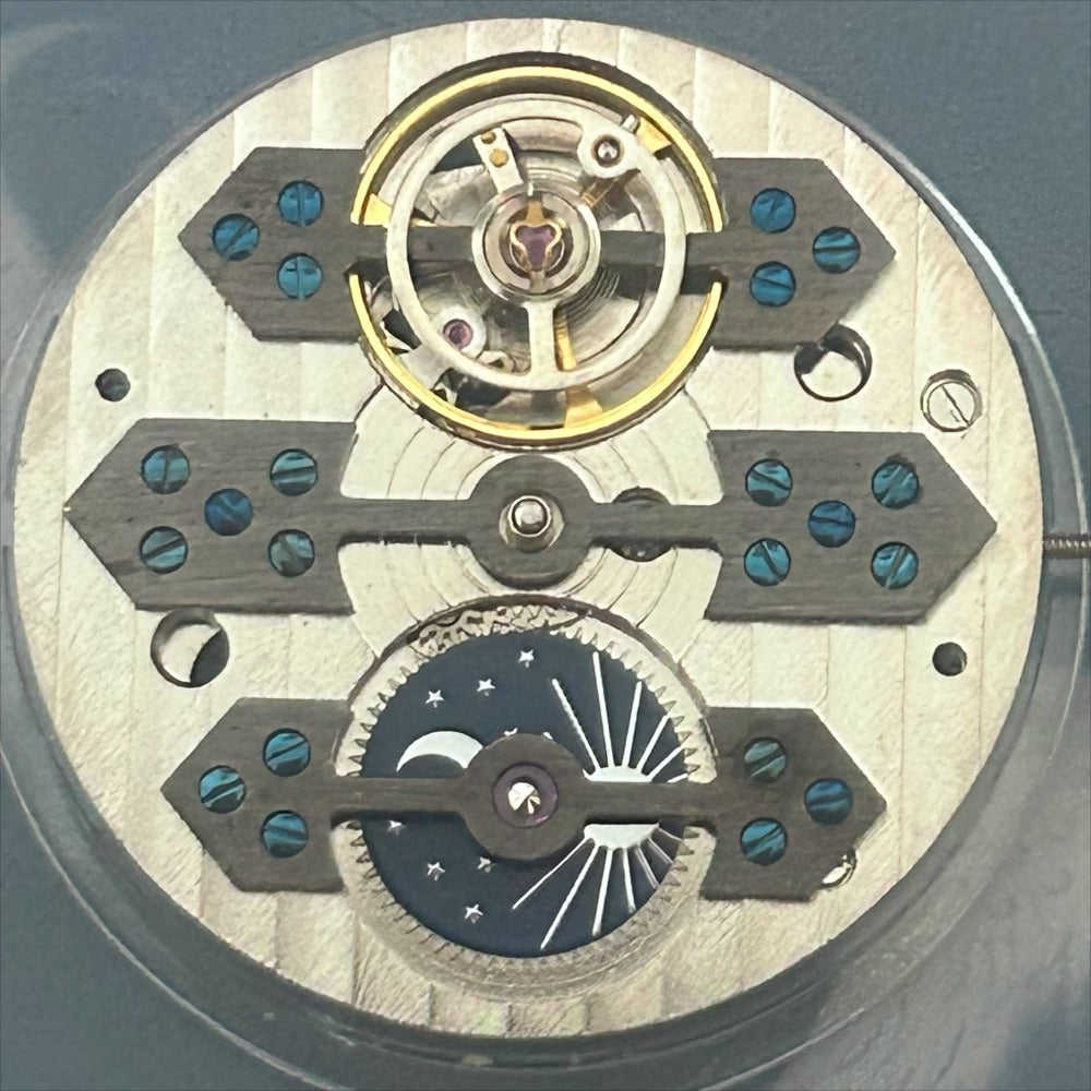 Mechanical watch repair part with moonphase feature, precise China-made movement for watch accessories.