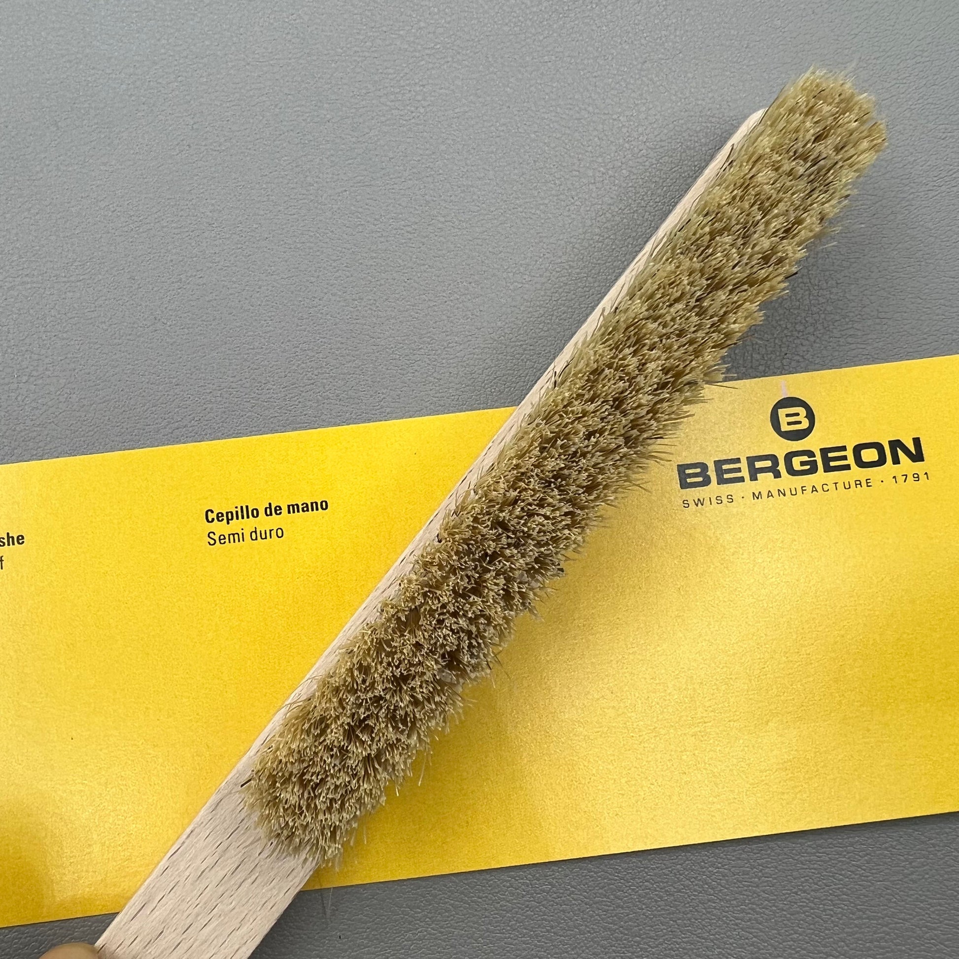 Swiss Bergeon 6377-2 hand brush with hard bristles for precise watch accessory cleaning.