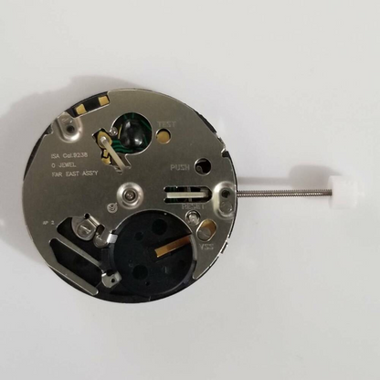Close-up of Silver ISA 9238 quartz watch movement part, precision accessory for repairs and maintenance.