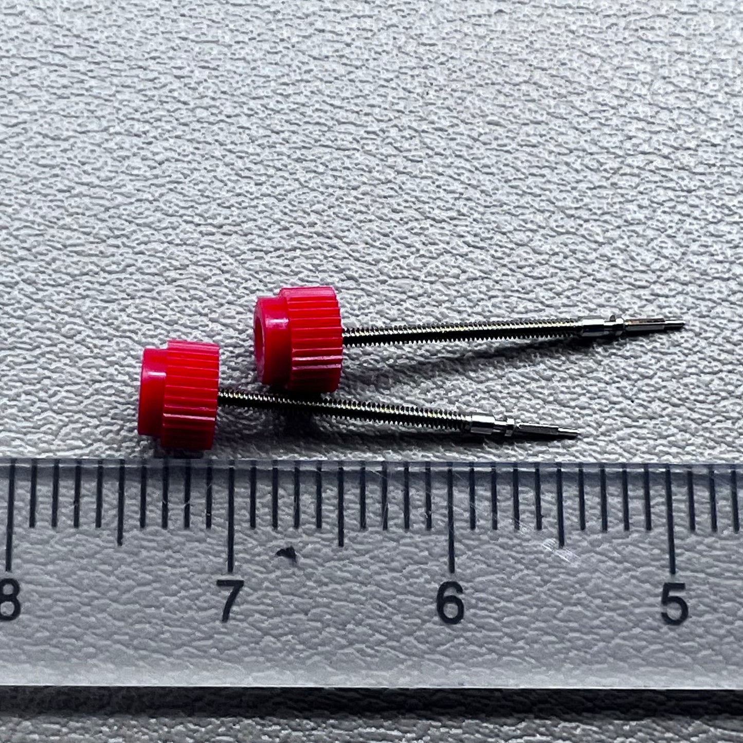 Set of 2 original .405 watch winding stems for ETA 902.002 movement, precision replacement parts.