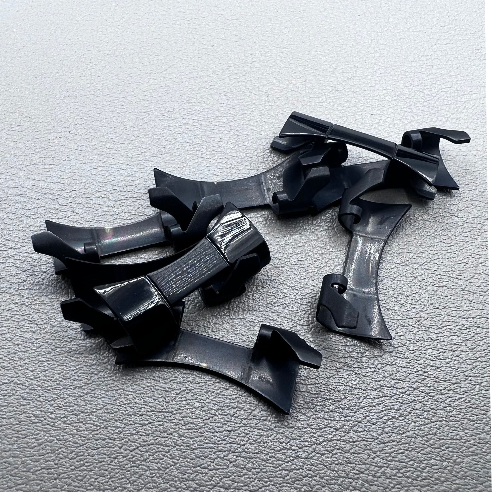 1. Six steel black matte curved end links with spring bars for durable watch band straps.  