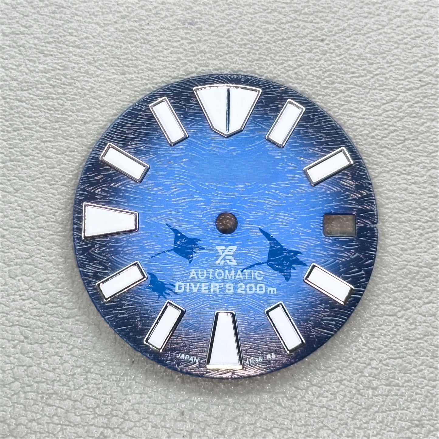 watch dial with S logo