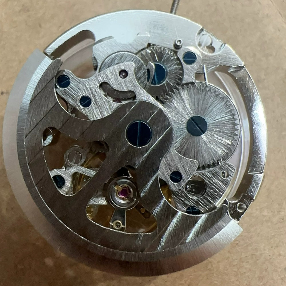 Silver hollow watch with 7120 automatic mechanical movement, 3 hands, large size - elegant timepiece.