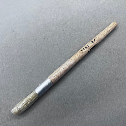 Swiss Bergeon 1307-02 white bristle brush for delicate watch cleaning and maintenance.