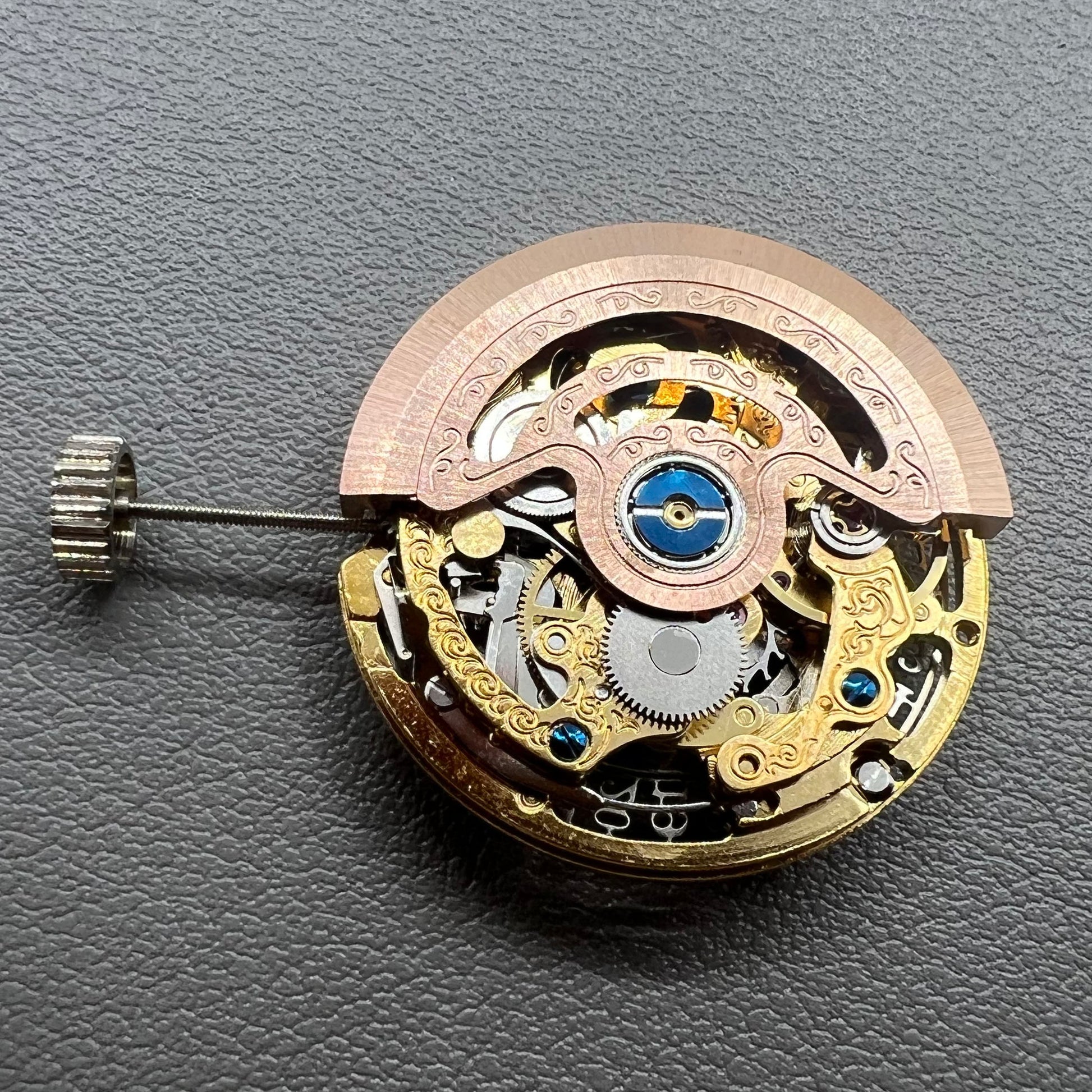 Hangzhou 2189 golden hollow watch movement showcasing intricate mechanical single calendar design.