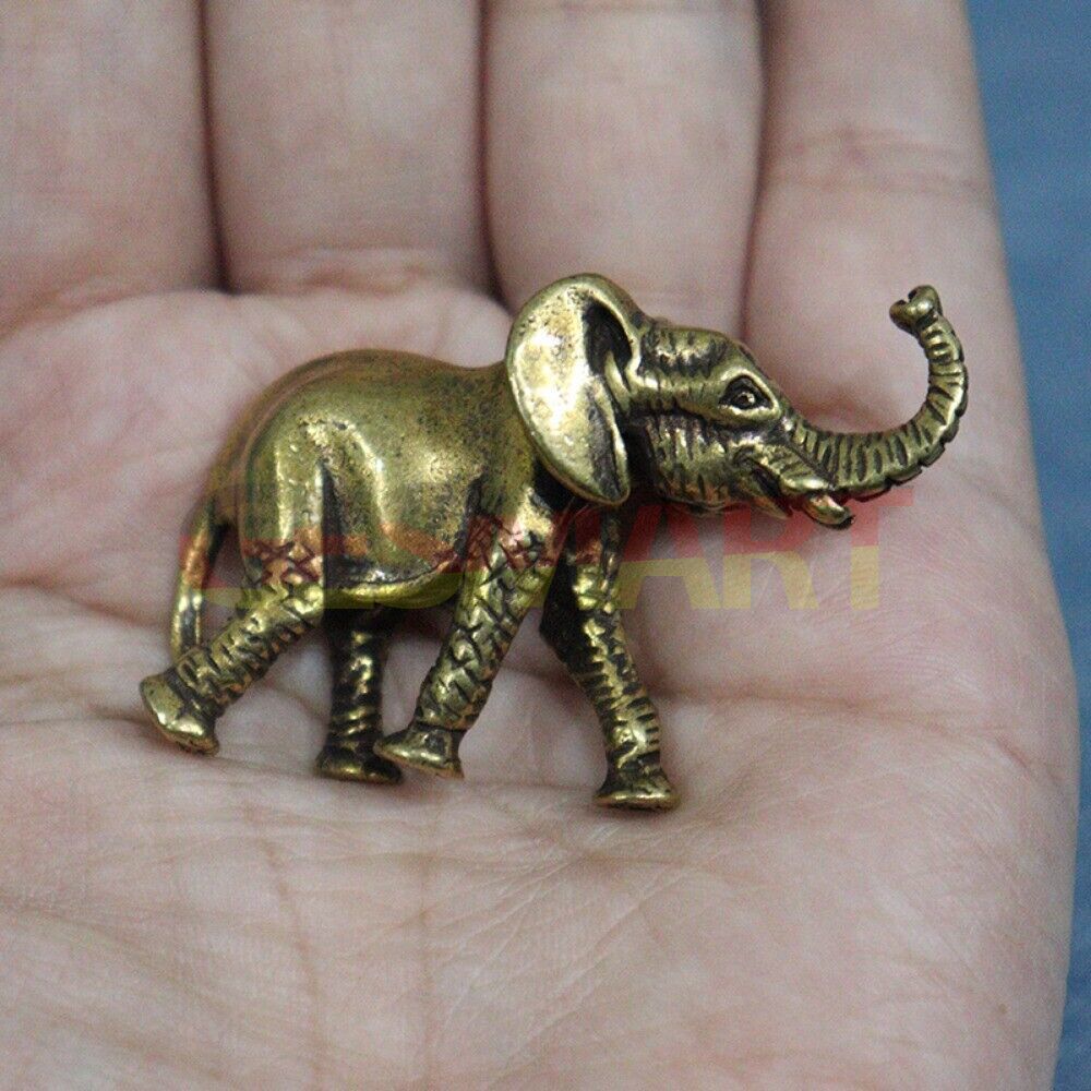 Hand-carved vintage solid copper elephant trinket, perfect for unique home decor accents.