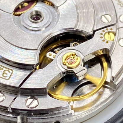 Close-up of China Made 3255 automatic watch movement featuring double calendar and narrow disk, precise mechanical design for watch accessories.