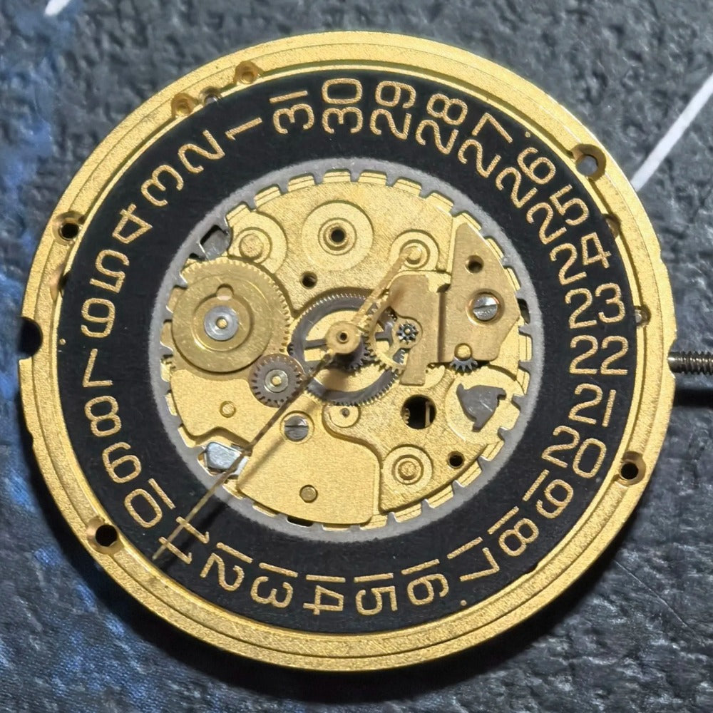 Swiss Made watch accessory featuring ETA255.412 quartz movement with black dial and gold accents.