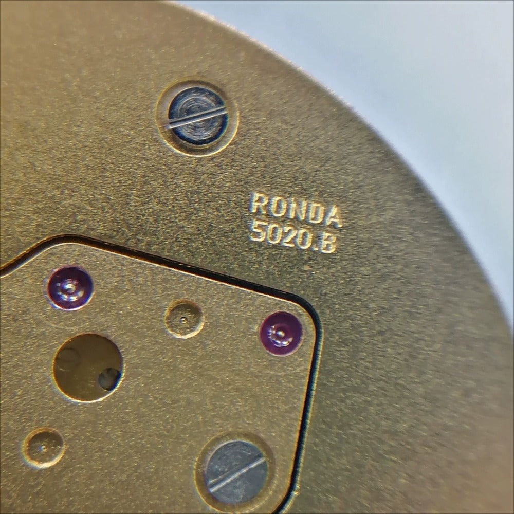 Swiss Made Ronda 5020.B quartz movement for precise golden watch repairs and upgrades.
