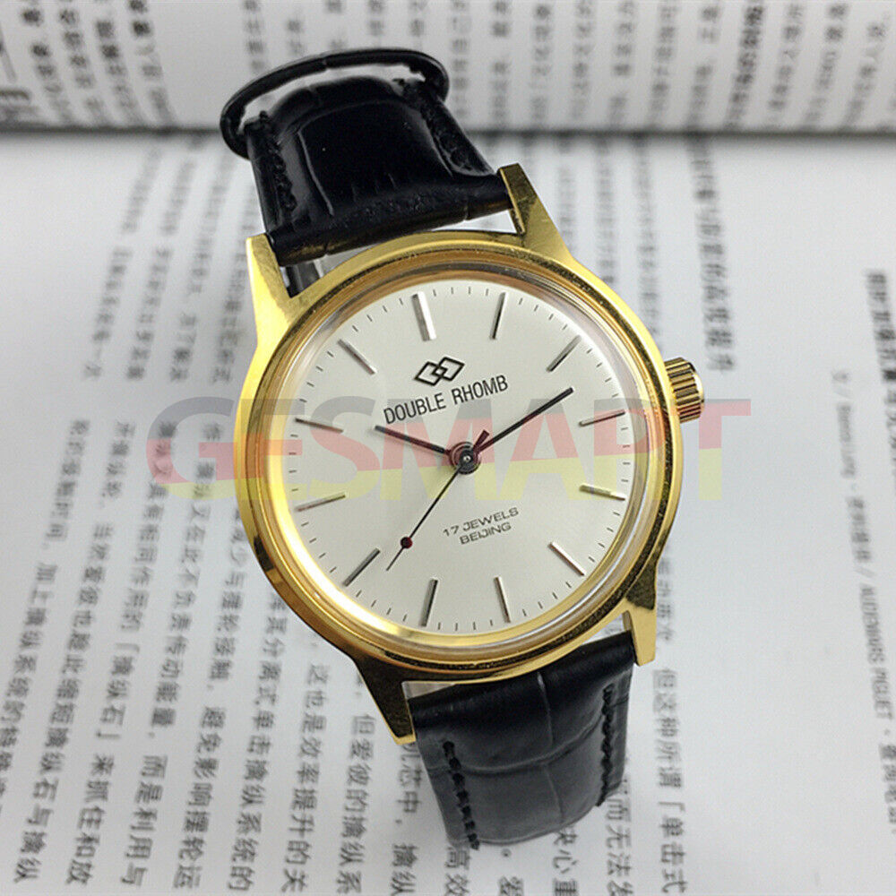 Beijing Double Rhomb manual watch with golden case, silver nail markers, classic style for collectors.