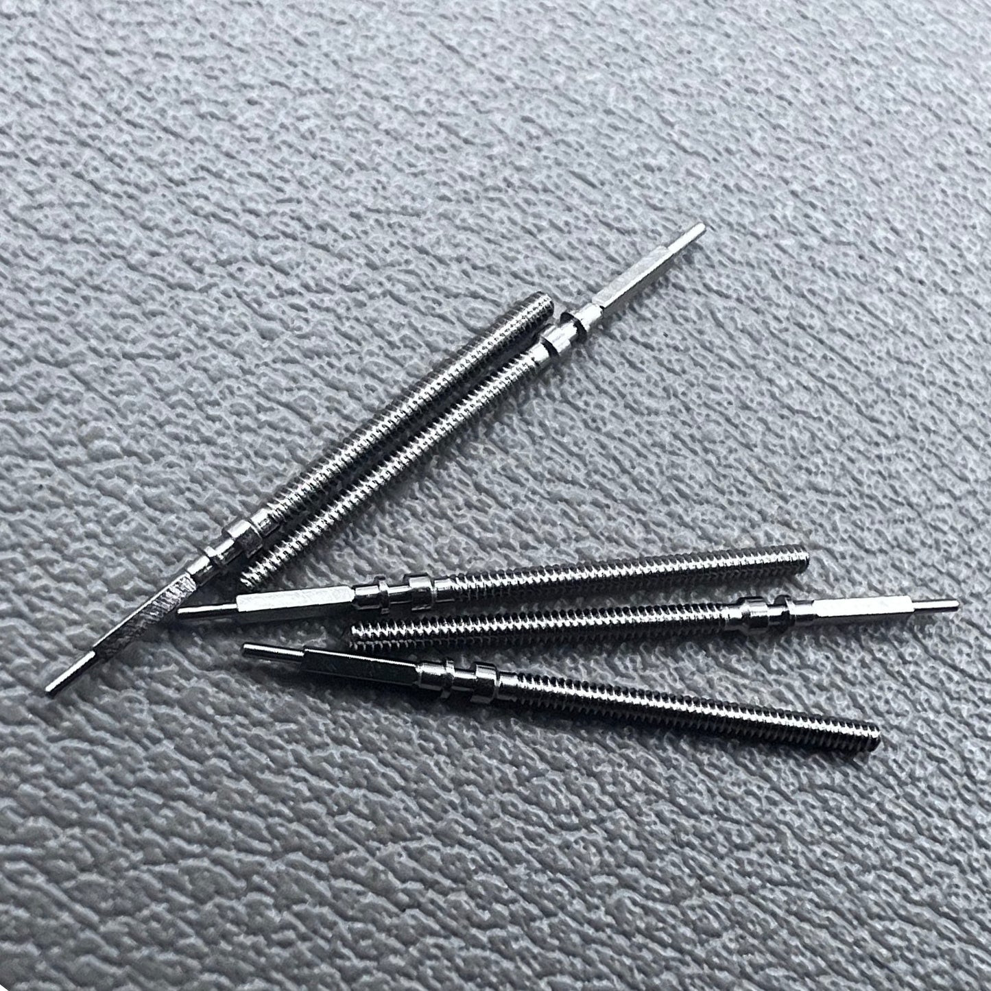 Set of 5 Omega winding stems for watch repair, compatible with 560-565 movements, precision spare parts.