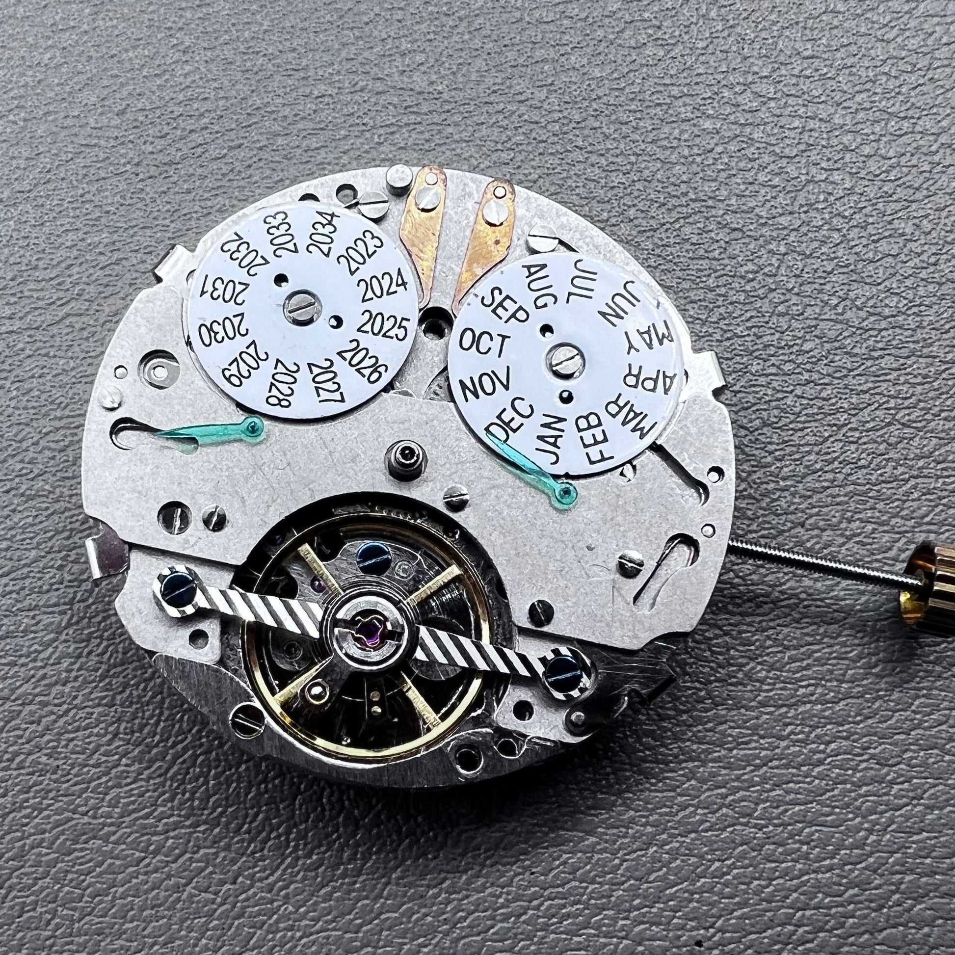 China multifunctional perpetual calendar watch accessory showcasing automatic mechanical movement details.
