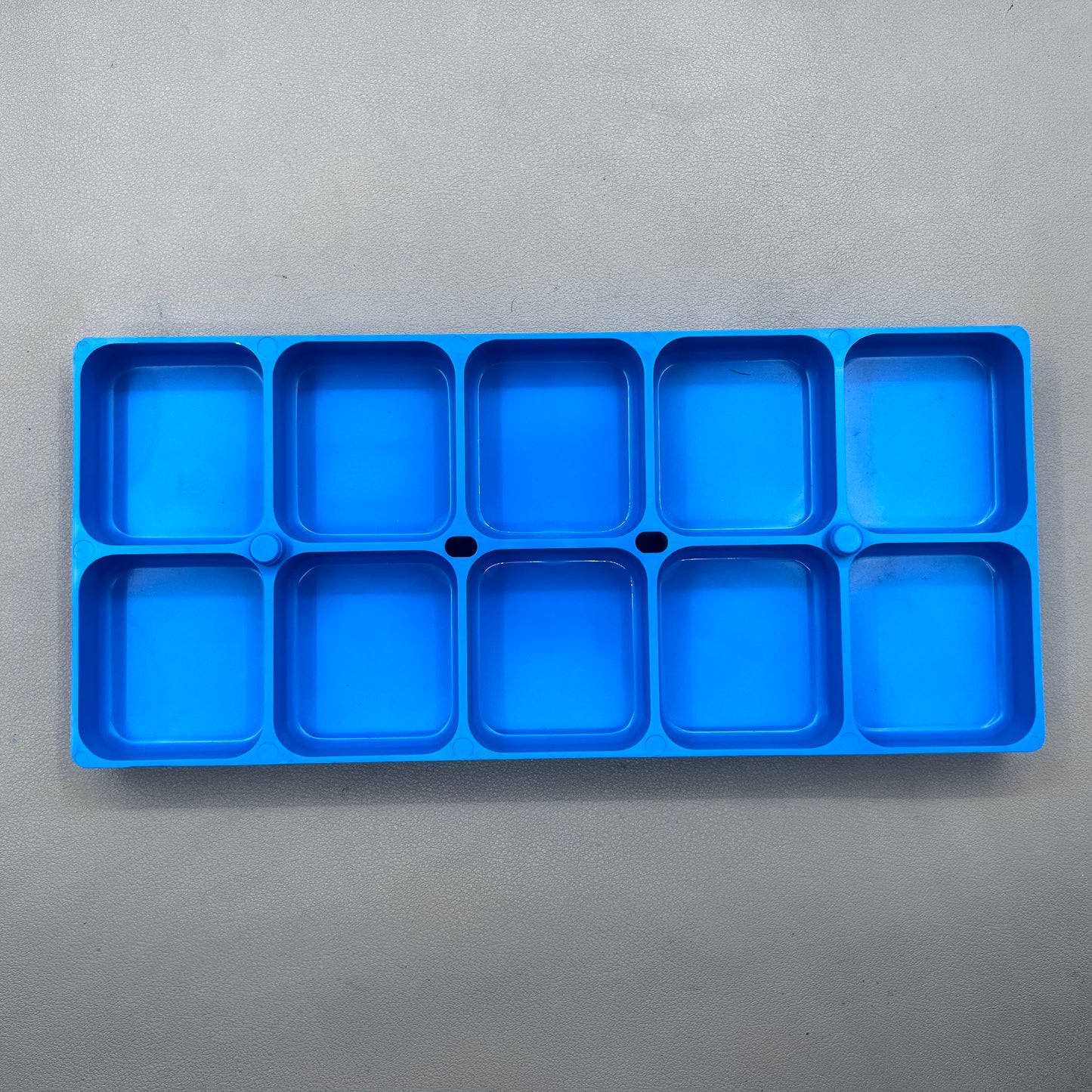 Swiss Horotec MSA17.530-B blue plastic watch accessory container with 10 compartments for organized storage.