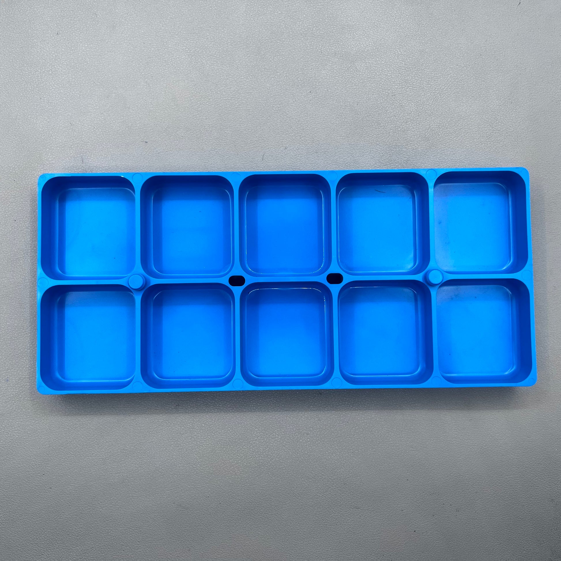 Swiss Horotec MSA17.530-B blue plastic watch accessory container with 10 compartments for organized storage.