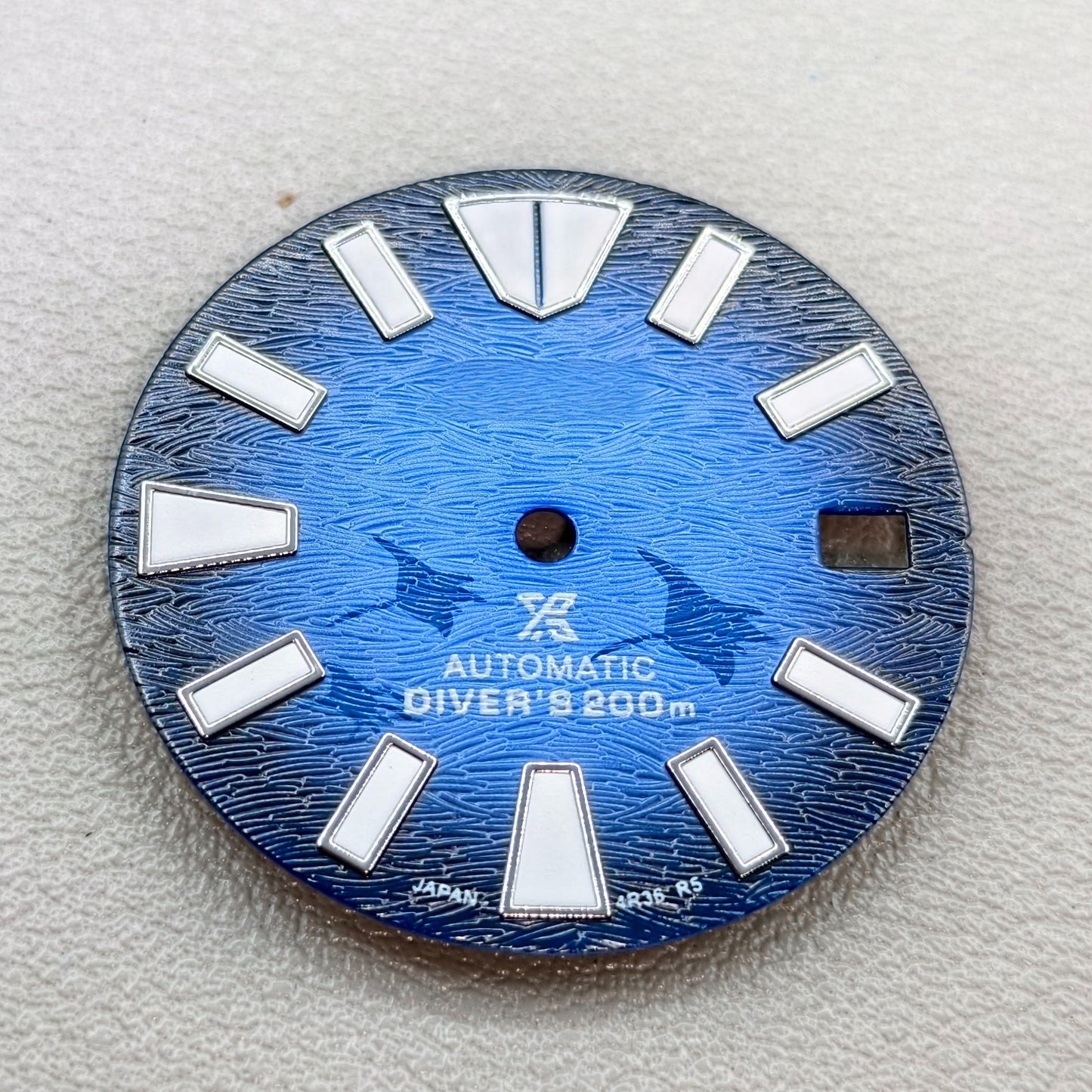 watch dial with S logo