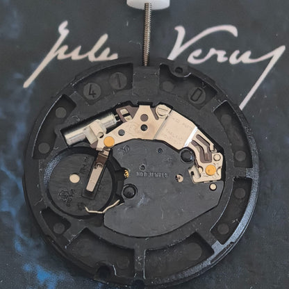 Swiss Made ETA805.144 quartz watch repair part with three white hands and disk for precise timekeeping.