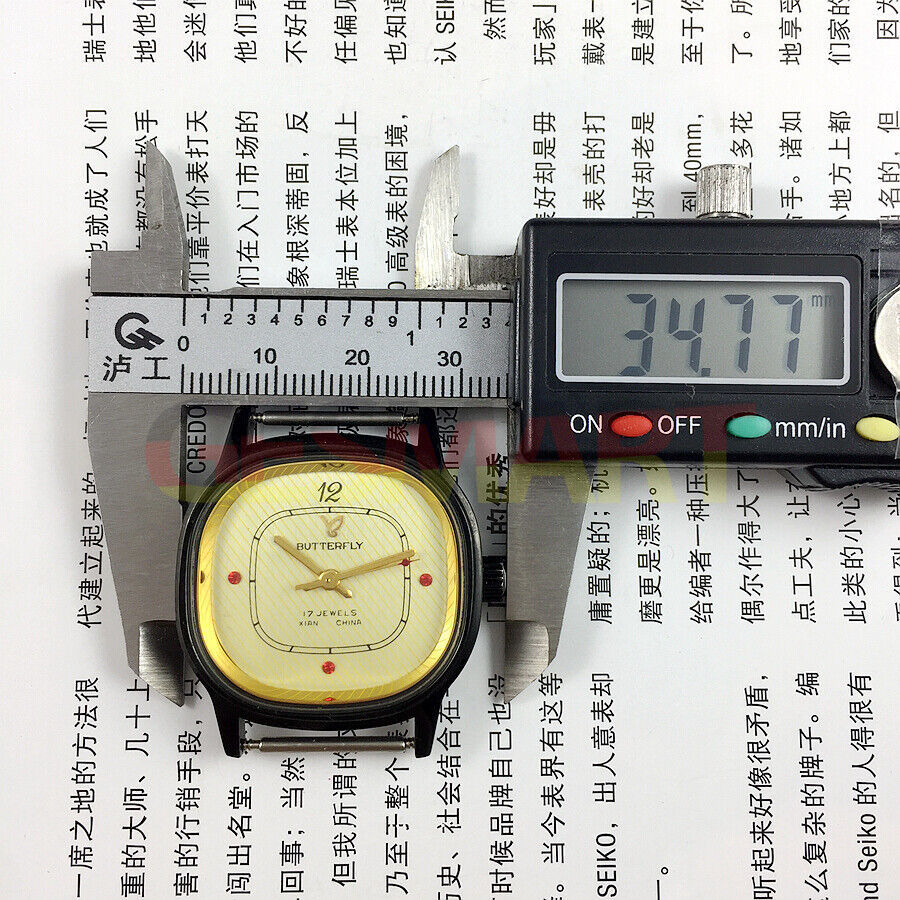 Yellow dial 32mm Chinese Xian manual mechanical watch with 17 jewels and black square case by Xian.