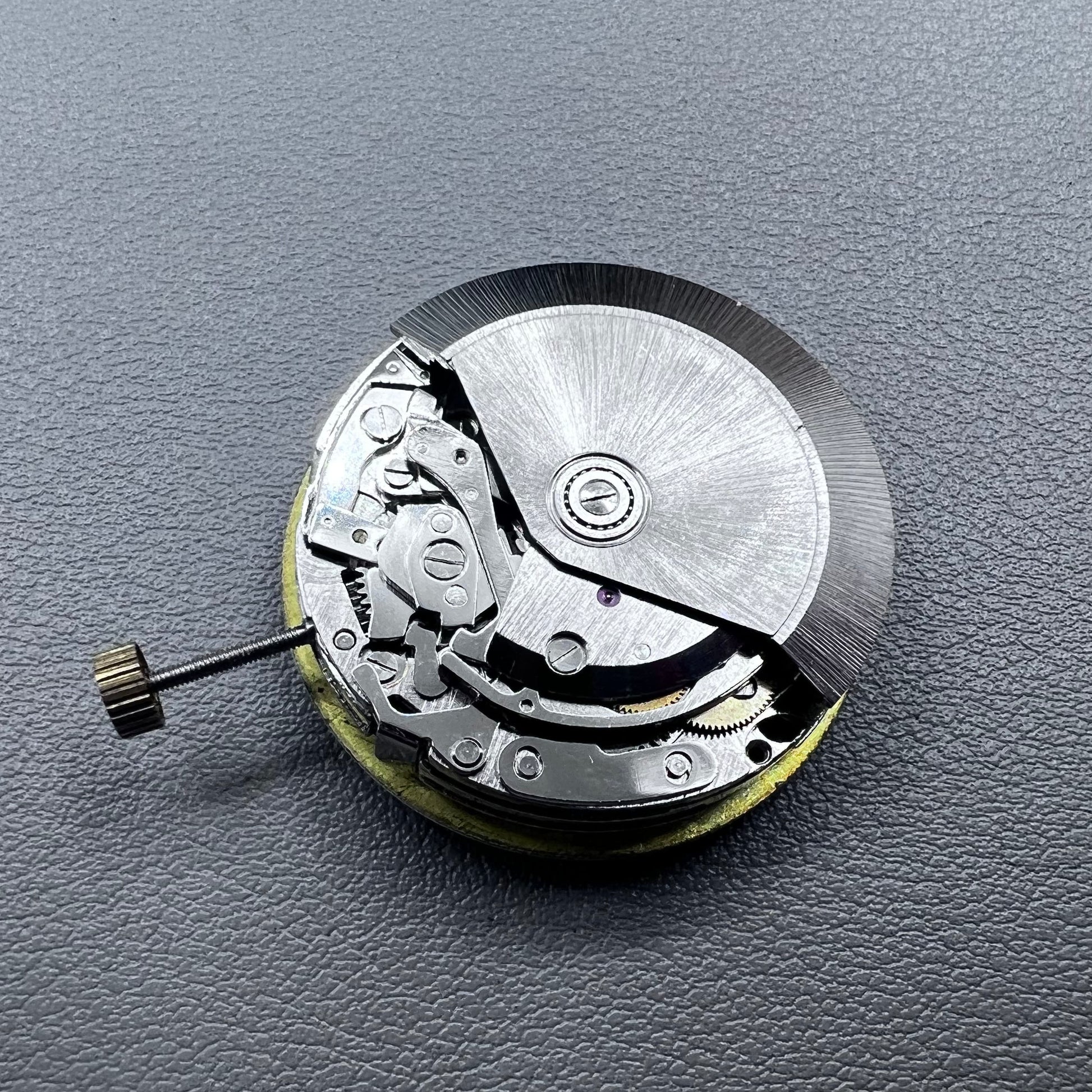 Shanghai 7750 mechanical watch movement with single calendar and small second at 9 o'clock, precision timekeeping.