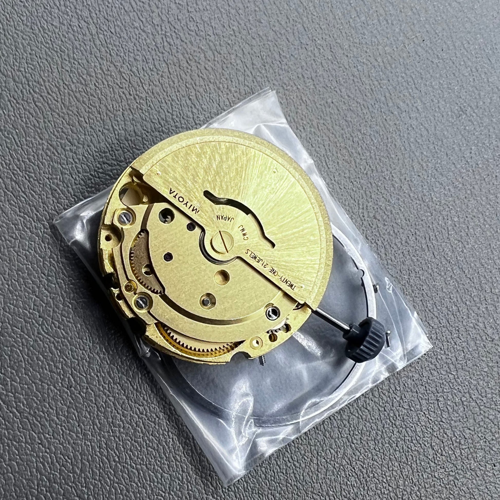 Golden plated Japan Miyota 8205 automatic mechanical watch movement, precision timekeeping component.