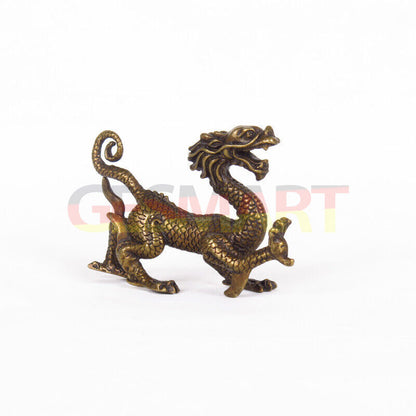 Solid copper dragon figurine, hand-carved with intricate details and polished finish.  