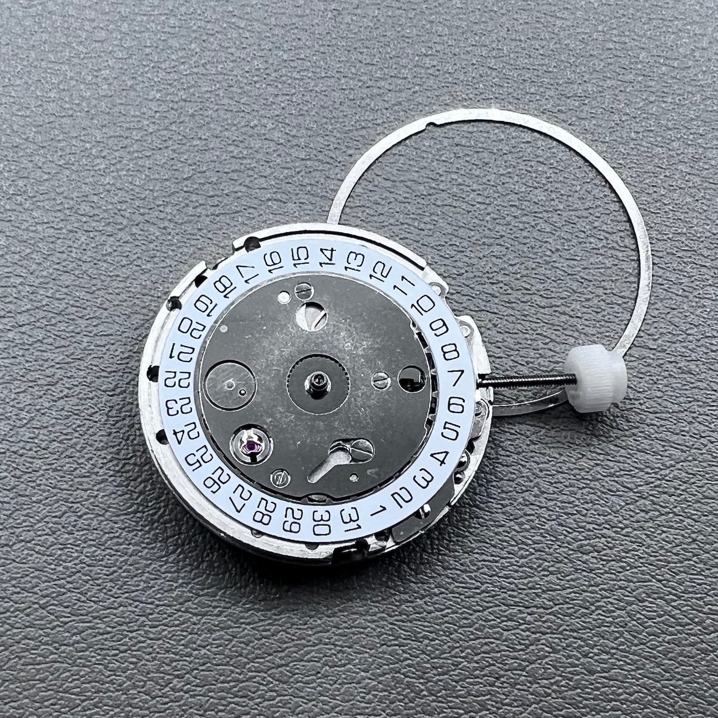 Silver plated DG2813 automatic watch movement with large and small hands, date display at 3 o'clock