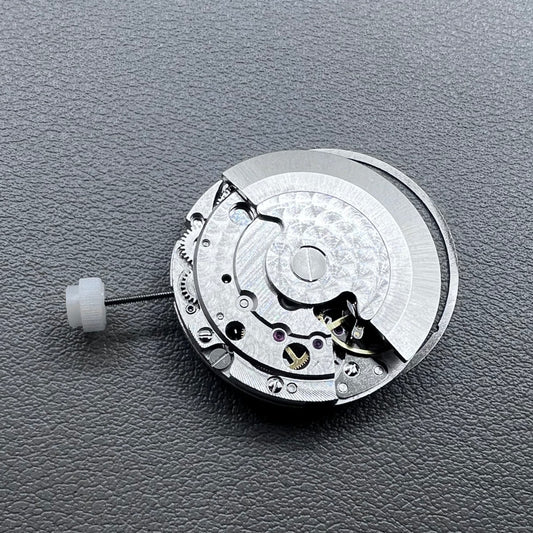 Silver plated DG2813 automatic watch movement with large and small hands, date display at 3 o'clock