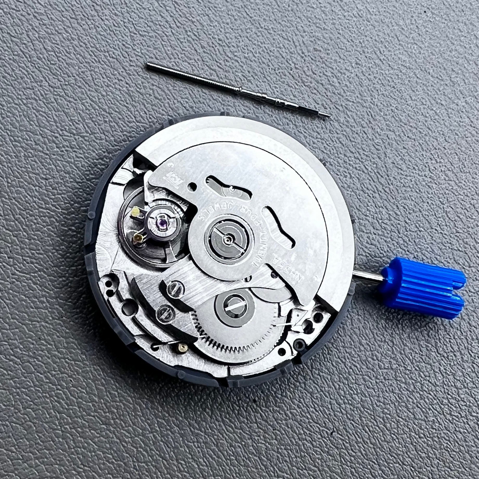 Seiko NH35A watch movement with black dial, 24 jewels, and date display at 6 o'clock for watch repairs.