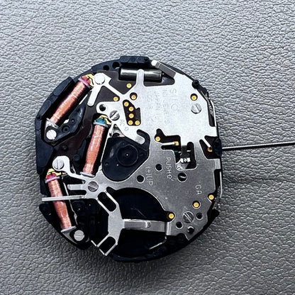 Original Japan VD59 watch movement close-up showing multifunctional quartz small second at 6/9/12 o'clock positions.