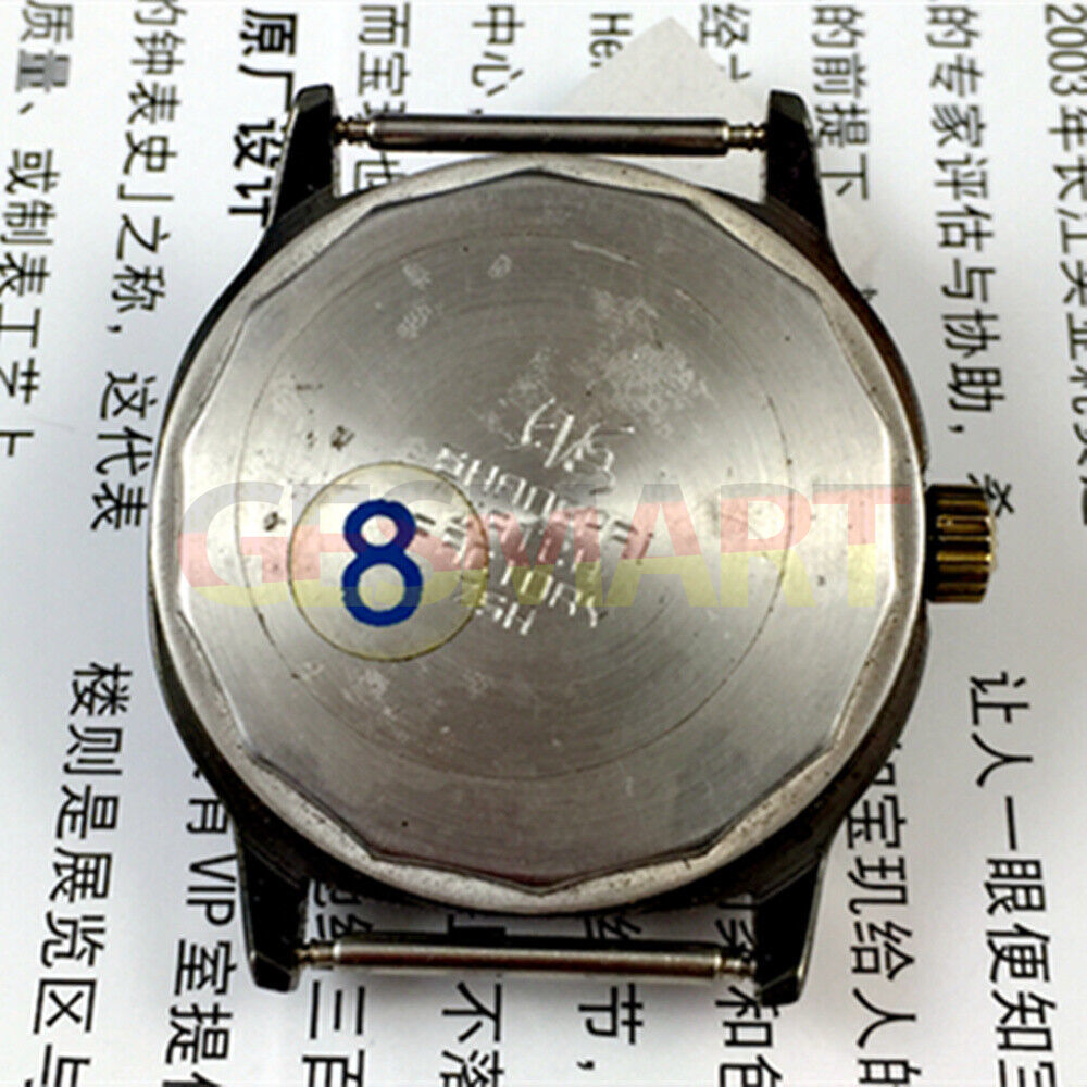 Shanghai Factory 34mm manual mechanical watch with black dial, 19 jewels, shock-resistant design.