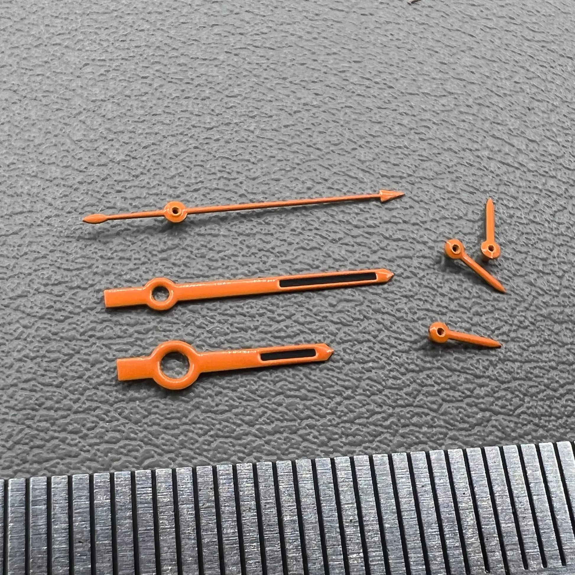 Orange-trimmed black watch hands with green lume, compatible with VK63 movement, perfect for precise timekeeping.