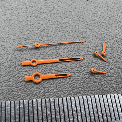 Orange-trimmed black watch hands with green lume, compatible with VK63 movement, perfect for precise timekeeping.